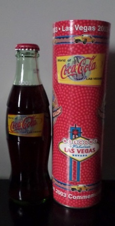 2002- € 30,00 coca cola flesje 8oz world of coca cola Atlanta 12th anniversary world of c.c. 3-8-2002 met koker.jpeg